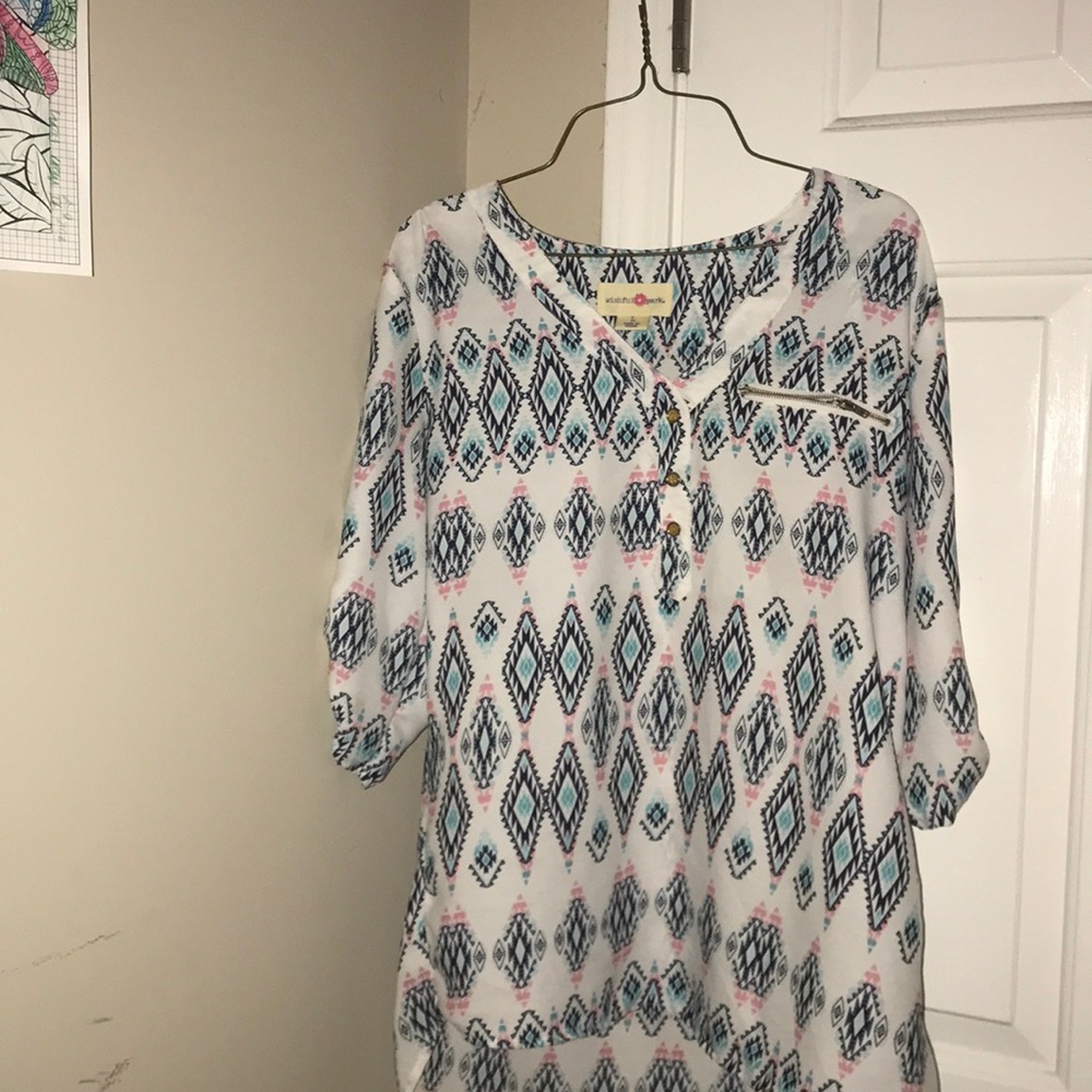 A mid sleeve shirt with a colorful pattern